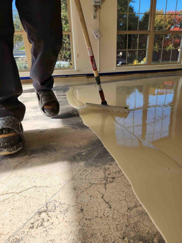  spreading Polyurea with a squeegee tool.